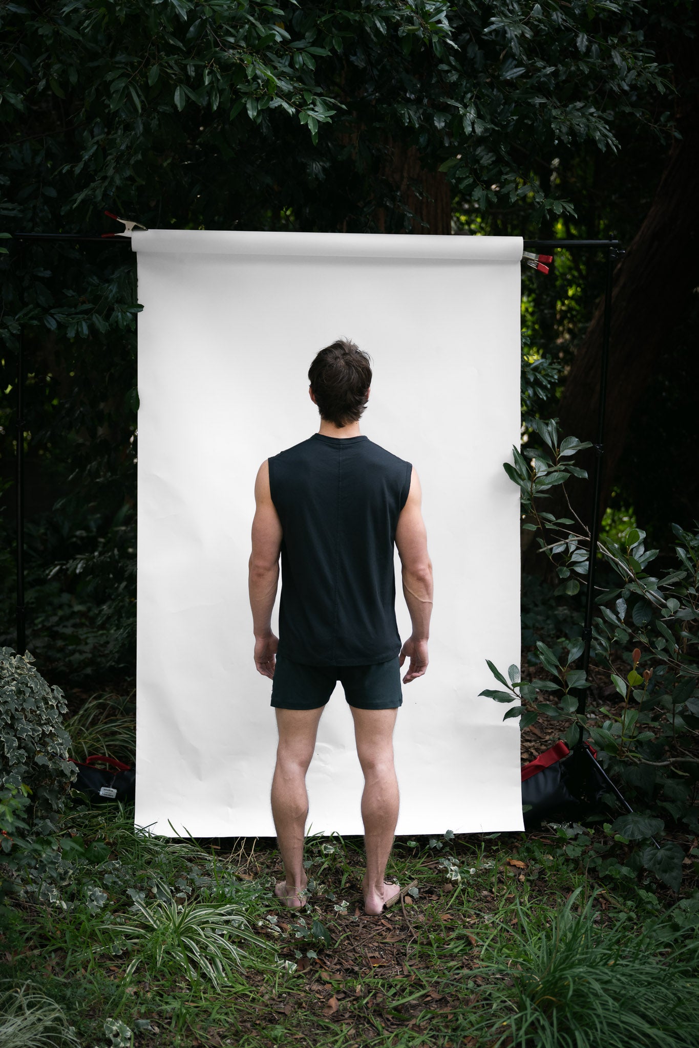Cinder | EDN Genesis mens muscle tee on-body rear view, organic cotton