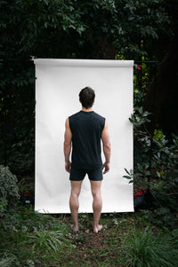 Cinder | EDN Genesis mens muscle tee on-body rear view, organic cotton