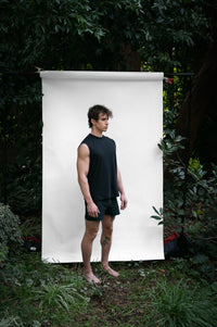 Cinder | EDN Genesis mens muscle tee on-body side view, organic cotton