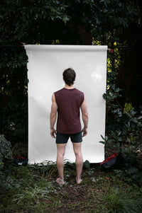 Clay | EDN Genesis mens muscle tee on-body rear view, organic cotton