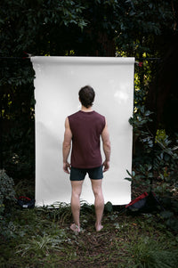 Clay | EDN Genesis mens muscle tee on-body rear view, organic cotton
