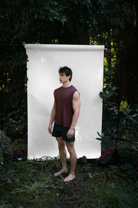 Clay | EDN Genesis mens muscle tee on-body side view, organic cotton